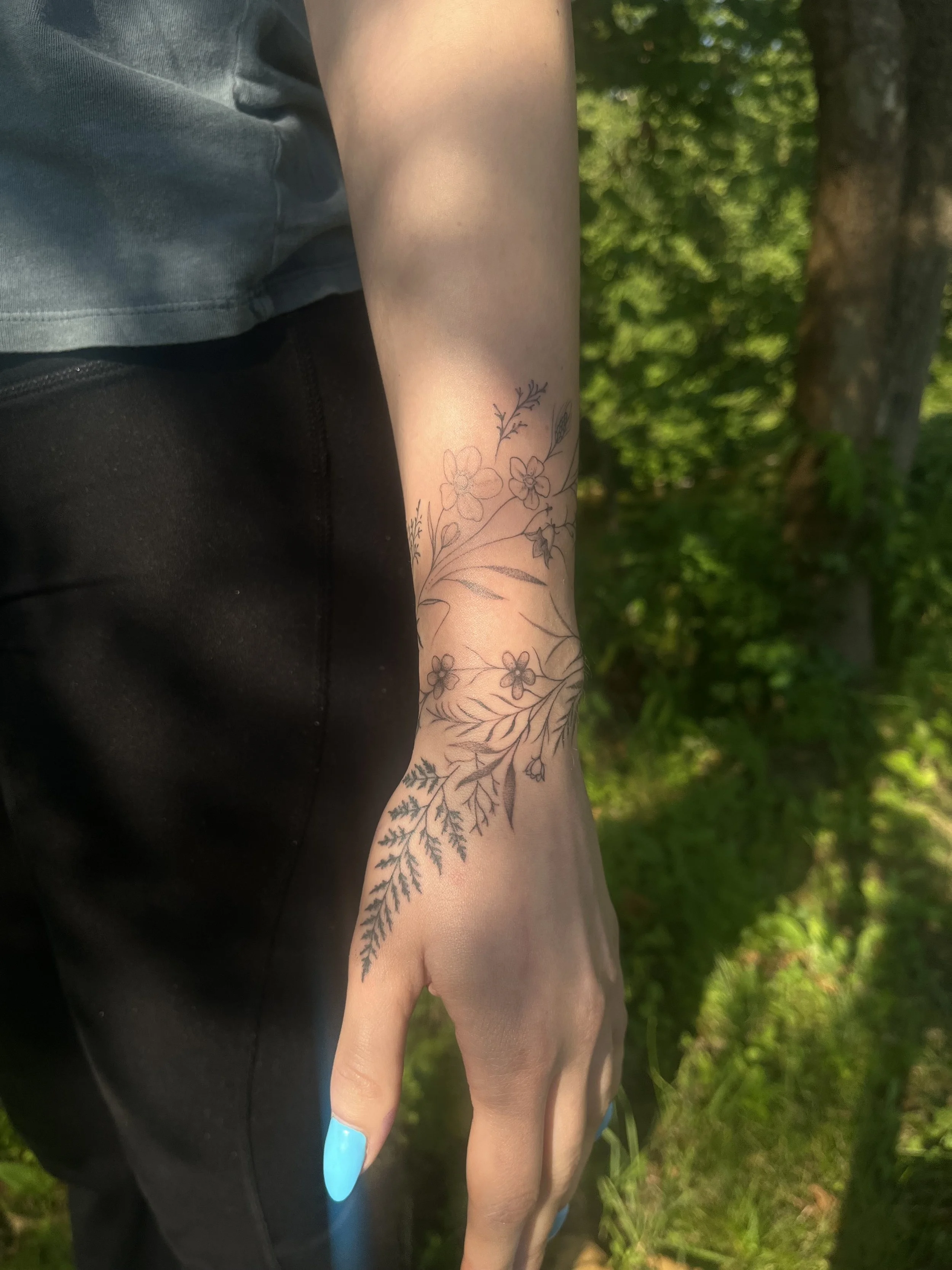Fine-line illustrative tattoo